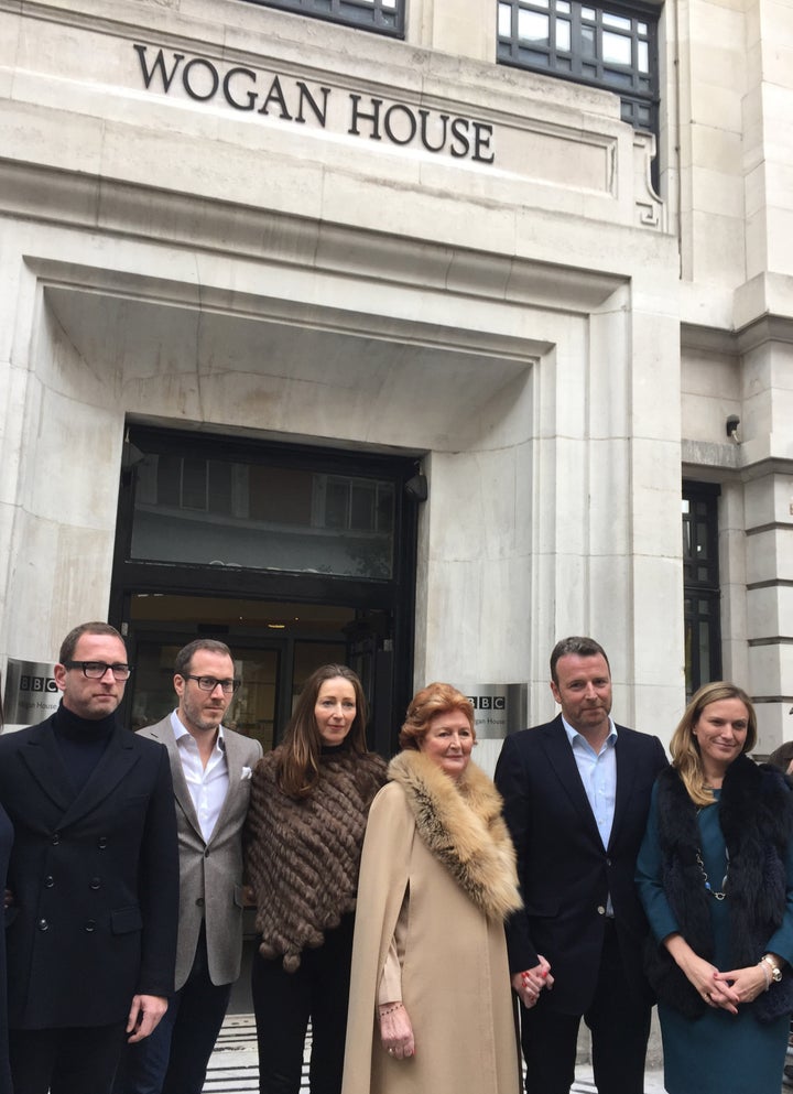 <strong>Sir Terry's family, including his widow Helen, outside Wogan House today</strong>