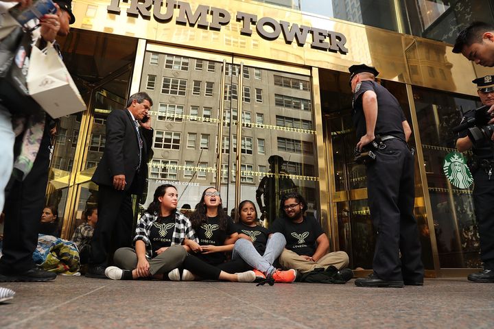 Protesters block the entrance to Trump Tower over Donald Trump's immigration policies in New York City before being arrested on Aug. 31. Now, college students are calling for "sanctuary campuses."