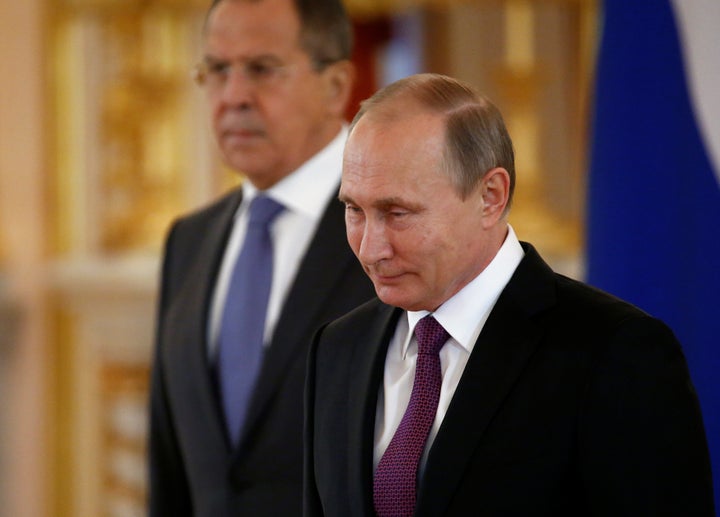 Russia's President Vladimir Putin and Foreign Minister Sergei Lavrov. On Wednesday, Russia announced it would withdraw from the ICC.