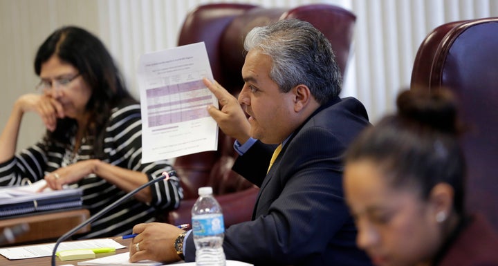 State Board of Education member Ruben Cortez Jr., center, questions a speaker during a hearing, April 8, 2014, in Austin, Texas. The Texas Board of Education voted 14-0 on Nov. 16, 2016, against approving a reviled Mexican-American studies textbook that is full of errors.