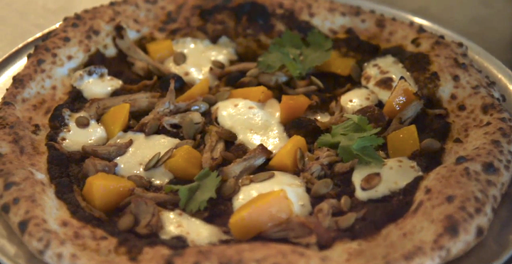 Bufalina serves a pizza made with produce that would otherwise have been thrown away at a private dinner on Oct. 9 in Austin, Texas.