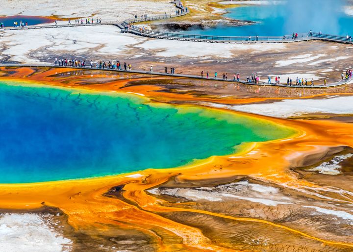 Yellowstone National Park is renowned for its geothermal features, such as the Grand Prismatic Spring (pictured above).