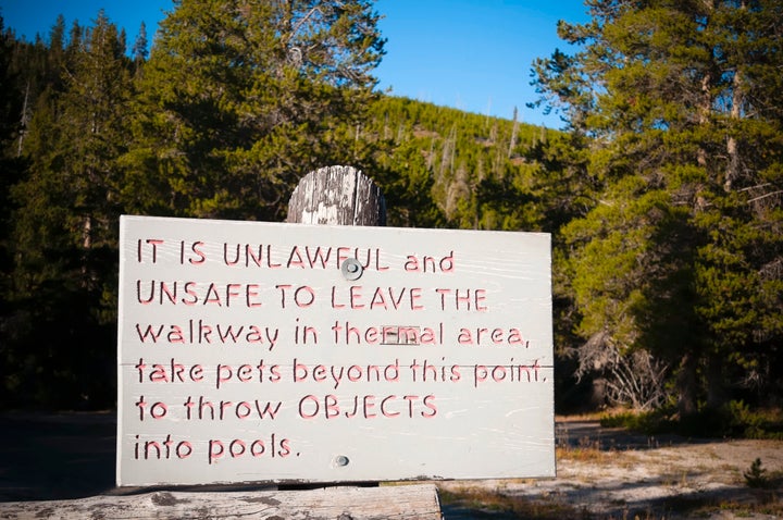 Warning signs are posted around Yellowstone National Park, advising visitors to keep out of thermal areas.