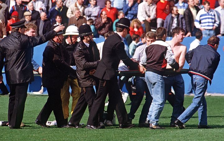 <strong>Policemen rescue soccer fans at Hillsborough stadium 15 April 1989</strong>