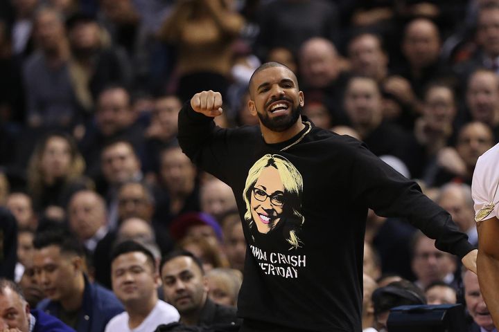 Wearing a shirt with the image of ESPN's Doris Burke, Drake cheers on the home team Toronto Raptors Wednesday against the Golden State Warriors. 