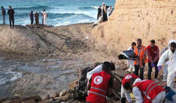 <strong>Members of the Libyan Red Crescent gather to treat the drowned bodies of illegal immigrants last week</strong>