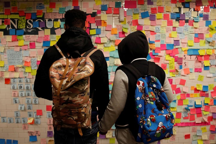 Post-it notes bearing messages of support and anti-Trump slogans cover a wall in New York City's Union Square subway station on Nov. 14, 2016. People are banding together to protect their neighbors from acts of hate.