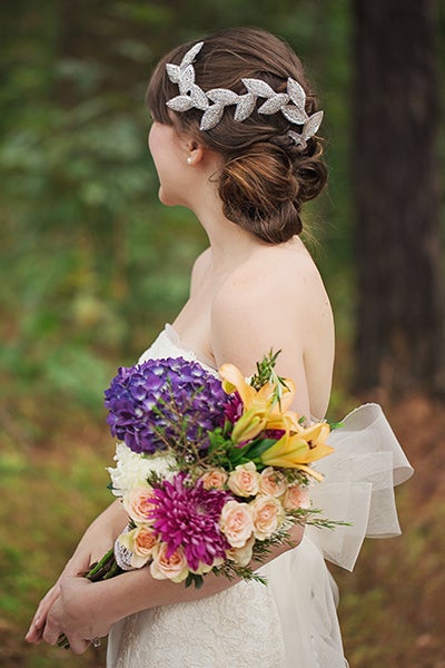 For a fresh and relaxed take on a bridal updo, consider a pretty off-center style on the side of your hair that will be facing the audience during your ceremony. 