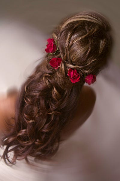 <p><p>A <a href="http://www.bridalguide.com/beauty-health/beauty/wedding-hair/half-up-hairstyles#154309" target=”_blank”><strong>half-up hairstyle</strong></a> interwoven with red roses is perfect for a <a href="http://www.bridalguide.com/planning/the-details/theme/classic-fairy-tale-wedding-ideas" target=”_blank”><strong>classic fairy tale wedding</strong></a>.</p></p>
<p><p>Related: <strong><a href="http://www.bridalguide.com/beauty-health/beauty/wedding-hair/hairstyles-with-flowers#159983" target="_blank">50+ Stunning Ways to Wear Flowers in Your Hair</a></strong></p></p>