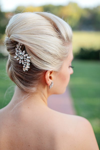 <p>A sleek French twist is striking yet simple to create. For a modern take, try adding subtle volume at the crown of the head.</p>