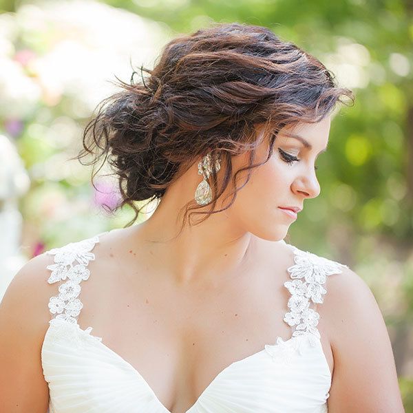 We're swooning over the wispy texture of this bride's updo — it's romantic without trying too hard.