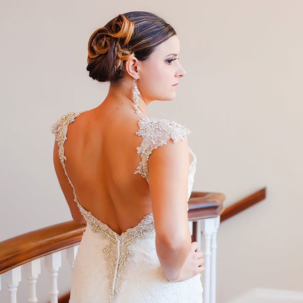 If you're inspired by vintage wedding details, borrow your hairstyle from a different decade, too, with pin-up curls that'll make you feel like a starlet on your big day.