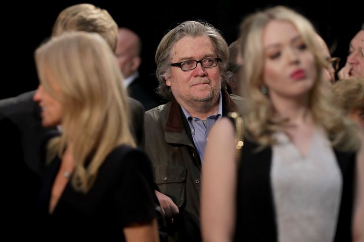 Steve Bannon (C) listens to Trump speak during his final campaign rally on Election Day in the Devos Place November 8, 2016 in Grand Rapids, Michigan.