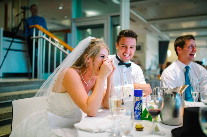 The bride couldn't stop smiling during the toast. 