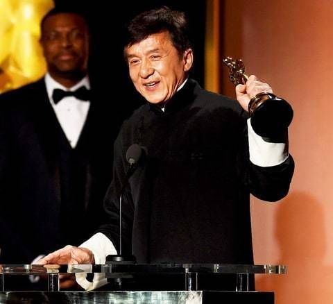 Jackie Chan receiving the Oscar award.
