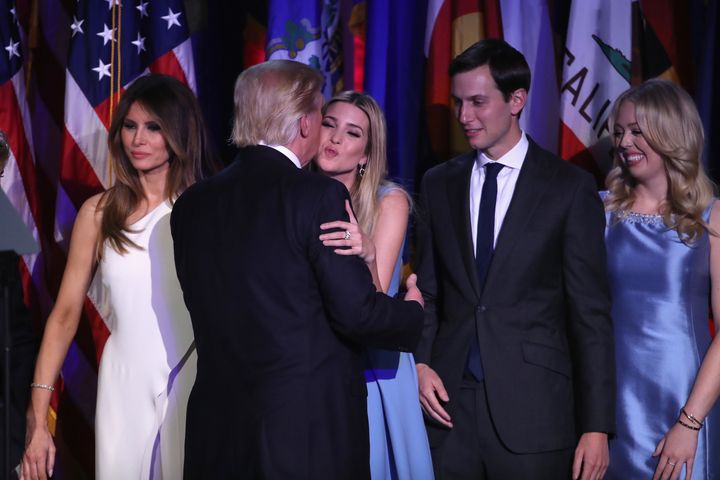 Republican President-elect Donald Trump and his daughter Ivanka Trump embrace on Nov. 9, as he stands next to wife, Melania Trump, while Jared Kushner and Tiffany Trump look on.