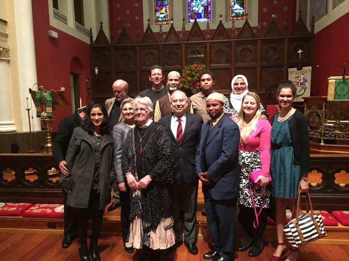 Ambassador Akbar Ahmed (center), The Rev. Gay Rahn (center-left) and Sheikh Rashid Lamptey of the Islamic Center of Fredericksburg (center-right) gather with audience members and community leaders in St. George’s Episcopal Church following Ahmed’s lecture on building bridges of understanding.