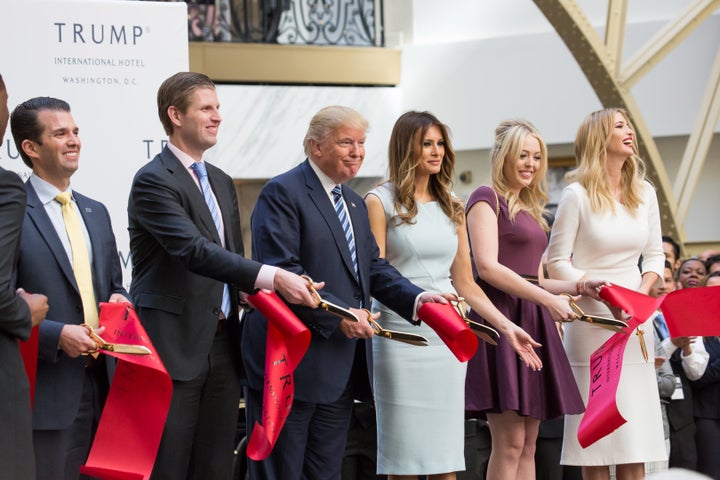 Donald Trump and his family cut the ribbon to open the Trump International Hotel in Washington. The hotel operates on a lease from the General Services Administration.