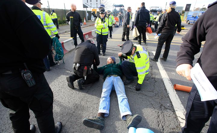 Traffic was brought to a standstill after the protesters lay on the road to protest the third runway
