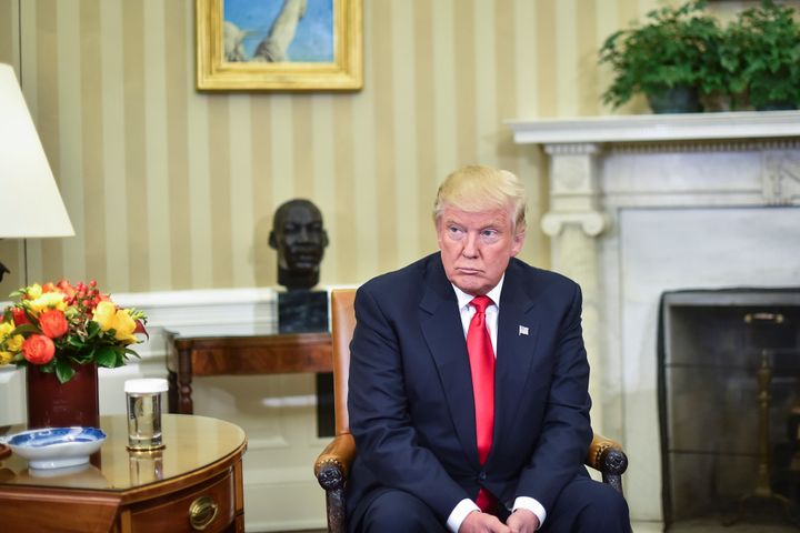President-elect Donald Trump listens as President Barack Obama talks to the media in the Oval Office of the White House in Washington, Thursday, Nov. 10, 2016.