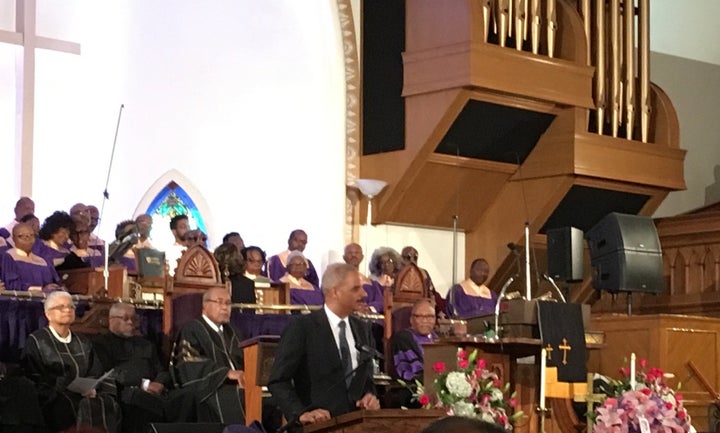 Eric Holder speaks at Gwen Ifill's funeral service in Washington on Saturday.