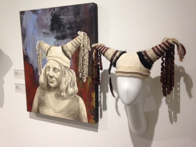 One of Kate Savage’s paintings and the “hair hat” that inspired it. 