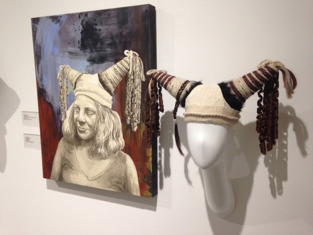 One of Kate Savage’s paintings and the “hair hat” that inspired it.