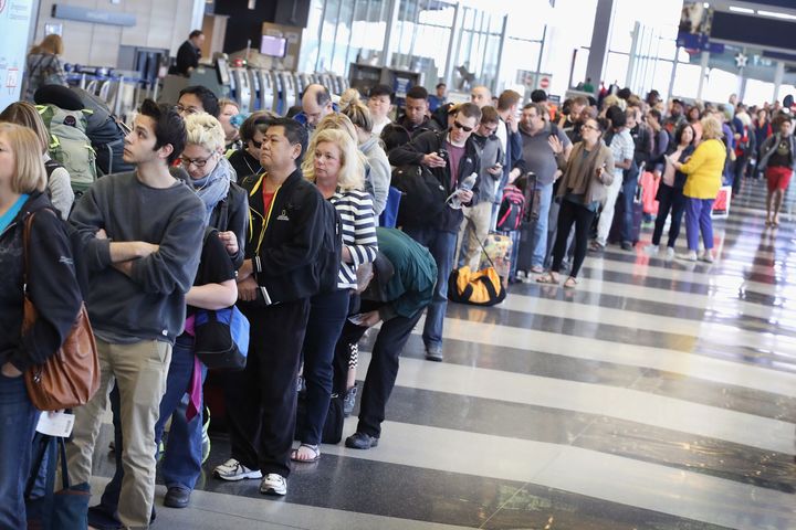 Passengers at O'Hare International Airport wait in line in May to be screened at a Transportation Security Administration checkpoint.