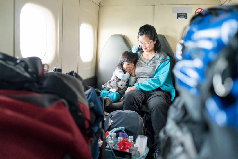 <em>On a propeller plane between Lukla and Kathmandu. Yes, the luggage is literally stacked like this.</em>