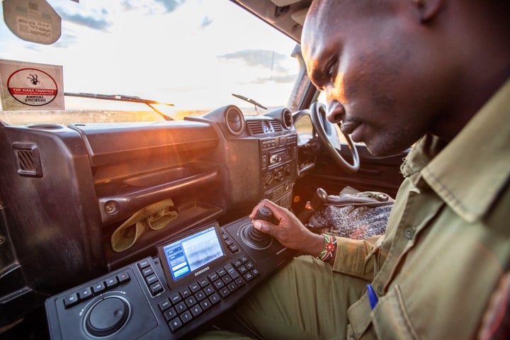 A ranger tests the FLIR thermal imaging camera in the Maasai Mara game reserve.