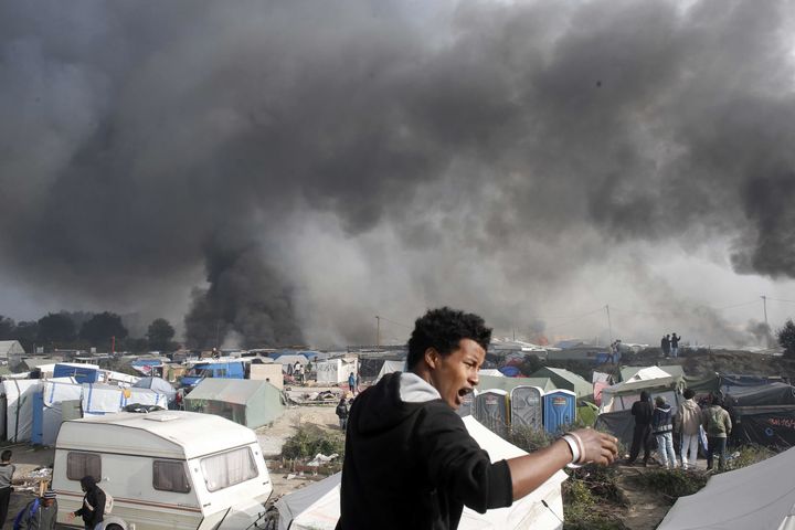 The Calais camp burns during the eviction on October 26