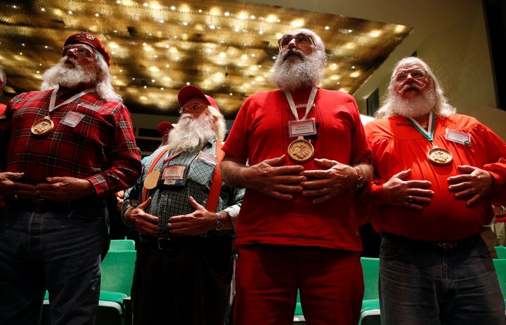 Santas learn breathing techniques as they attend one of the school's classes.