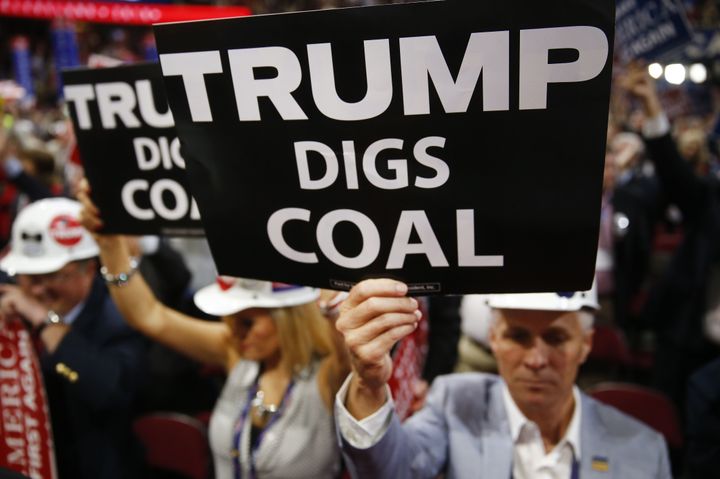 A delegate holds a sign reading 'Trump Digs Coal' during the Republican National Convention in July. 