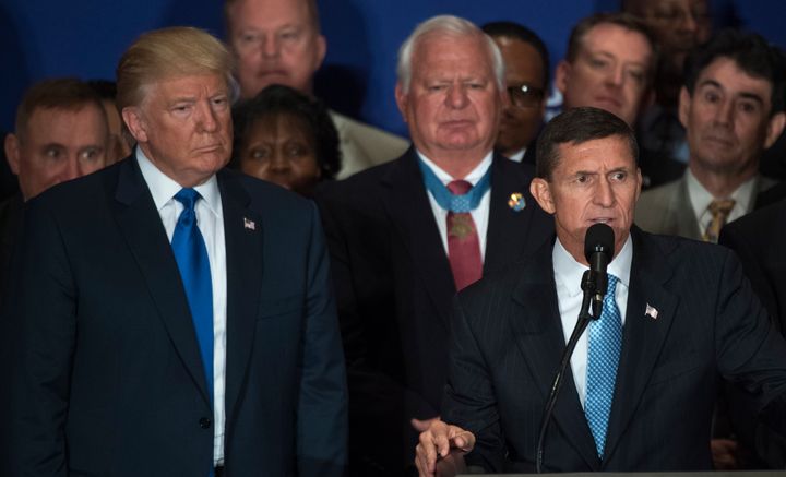 Retired Lt. Gen. Michael Flynn, at podium, and Republican presidential candidate Donald Trump attend a campaign event with veterans at the Trump International Hotel on Pennsylvania Ave., NW, where Trump stated he believes President Obama was born in the United States, September 16, 2016.