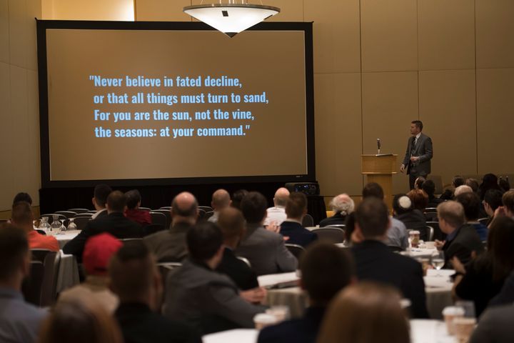 Supporters view an inspirational quote following a video presentation at a conference hosted by the white nationalist group National Policy Institute in Washington on Nov. 18. Critics say the group is racist and anti-Semitic.