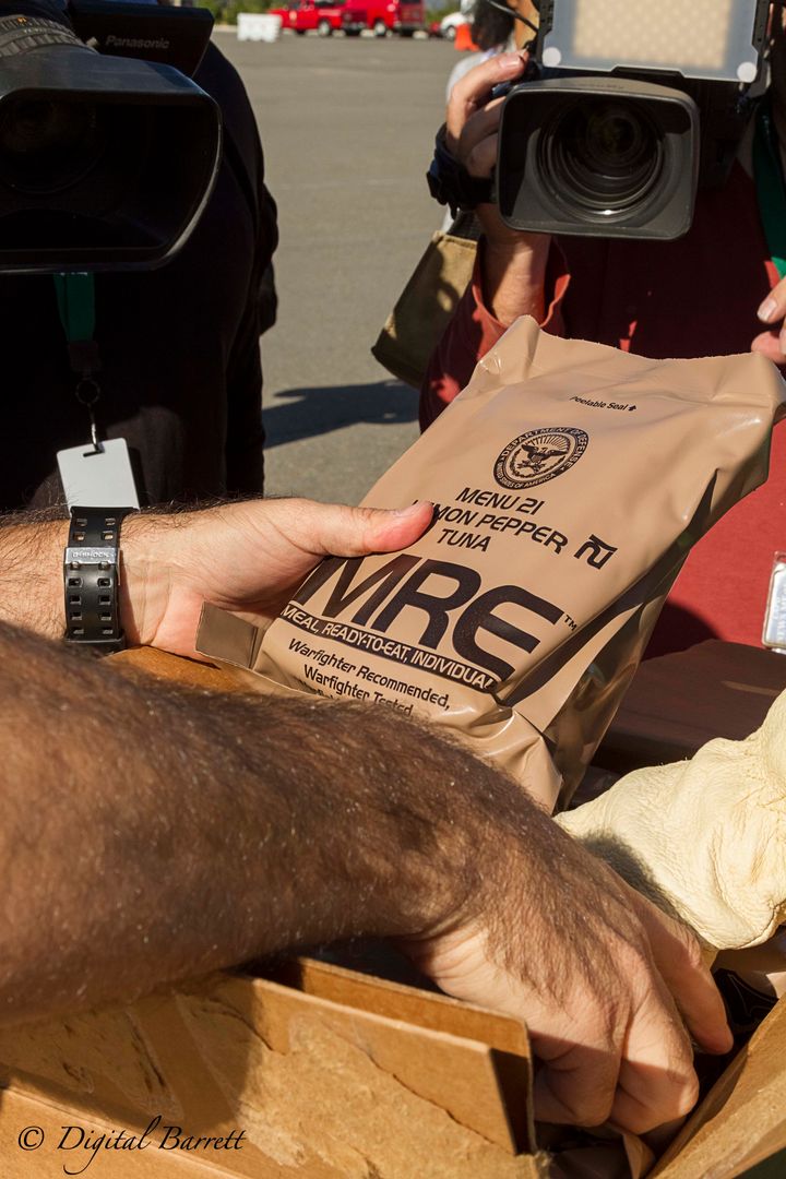<p>Boxes of “Meal, Ready-to-Eat” (MREs) were distributed to waiting vehicles at a Commodities Point of Distribution (C-POD) in Irvine</p>