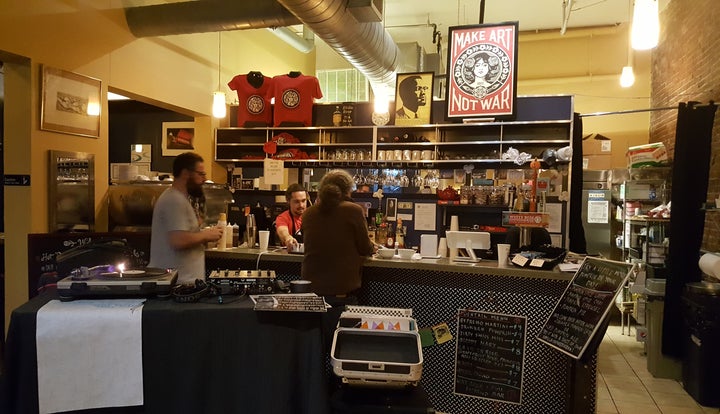 General Manager Patrick Nelson serves patrons at the White Rose Coffeehouse, Lynn, Mass.