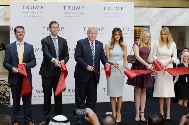 <strong>Trump and his family (l-r) son Donald Jr, son Eric, wife Melania and daughters Tiffany and Ivanka cut the ribbon at the new Trump International Hotel in Washington, in October </strong>