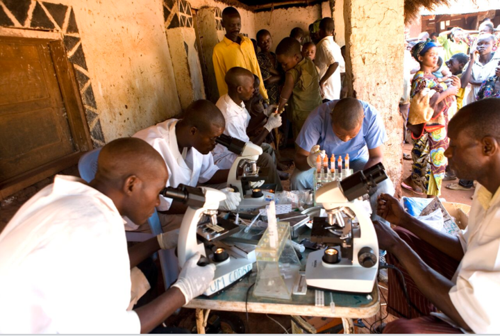 A mobile team from the Democratic Republic of Congo Sleeping Sickness Program at work in Mpata screening villagers for sleeping sickness.