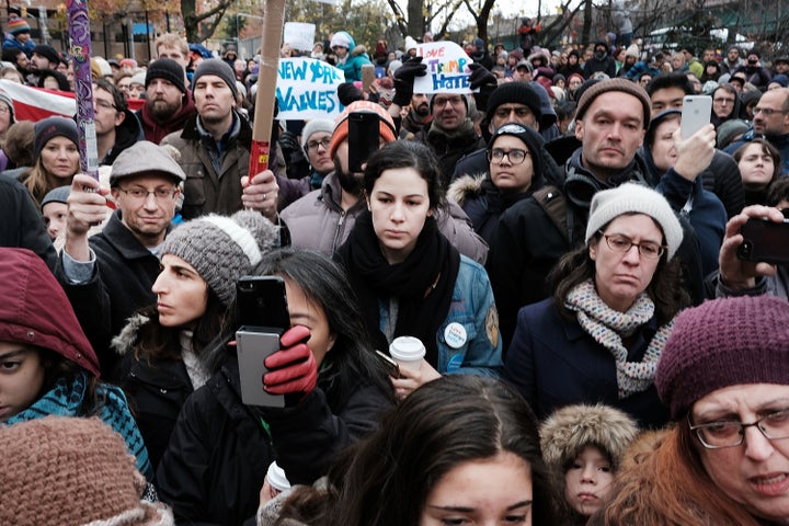 People participate in an anti-hate rally on Nov. 20 at a Brooklyn park named in memory of late Beastie Boys band member Adam