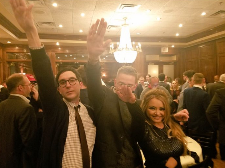 Tila Tequila poses with two others while performing the Nazi salute.