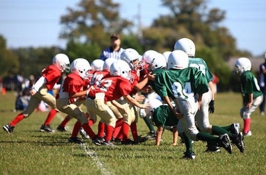 Youth football players playing a game at Camp Lejeune, NC. 