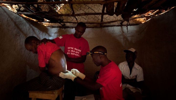 Doctors Without Borders staff perform a spinal tap in the village of Basoloy, region of Doromo, northeastern DRC. 