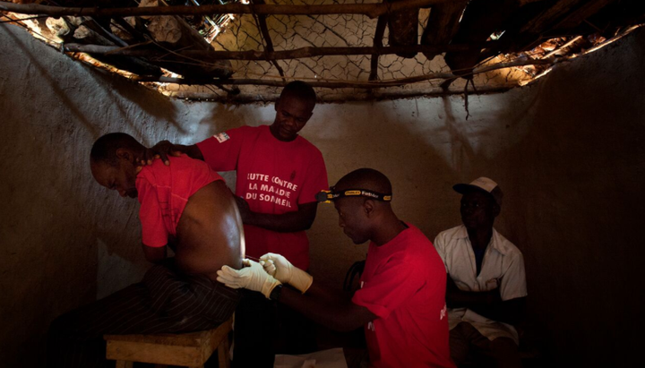 Doctors Without Borders staff perform a spinal tap in the village of Basoloy, region of Doromo, northeastern DRC.