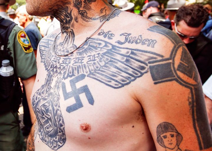 A supporter of the Ku Klux Klan is seen with his tattoos during a rally at the statehouse in Columbia, South Carolina July 18, 2015.