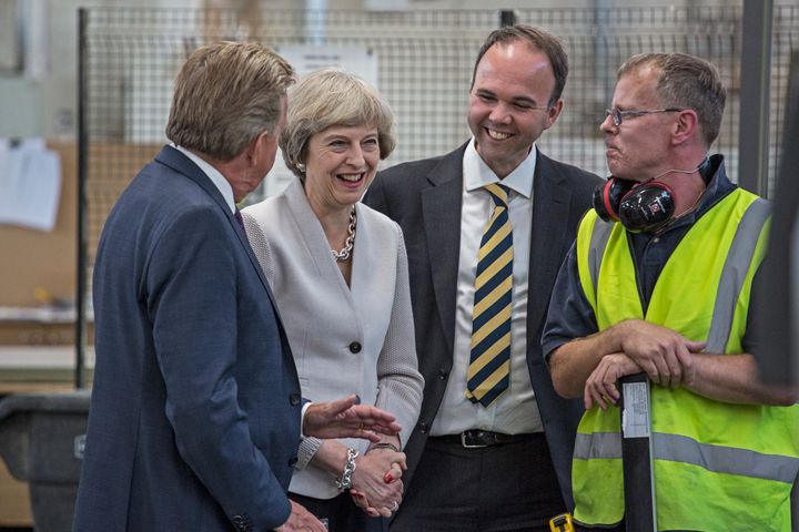British Prime Minister Theresa May, Martek Managing Director Derek Galloway (L) and Croydon Central MP Gavin Barwell (2ndR)