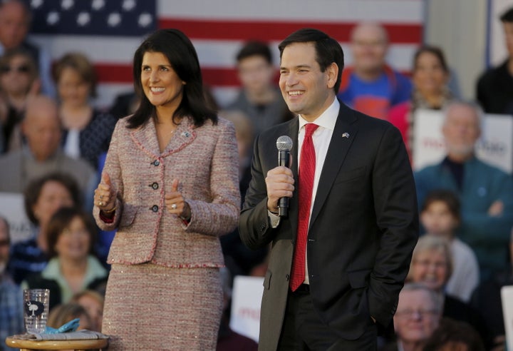 Marco Rubio smiles as he speaks while South Carolina Governor Nikki Haley gives a thumbs up during a campaign event in Chapin, South Carolina February 17, 2016.