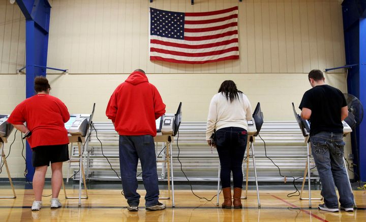 Voters cast their votes during the U.S. presidential election in Elyria, Ohio, U.S. November 8, 2016.