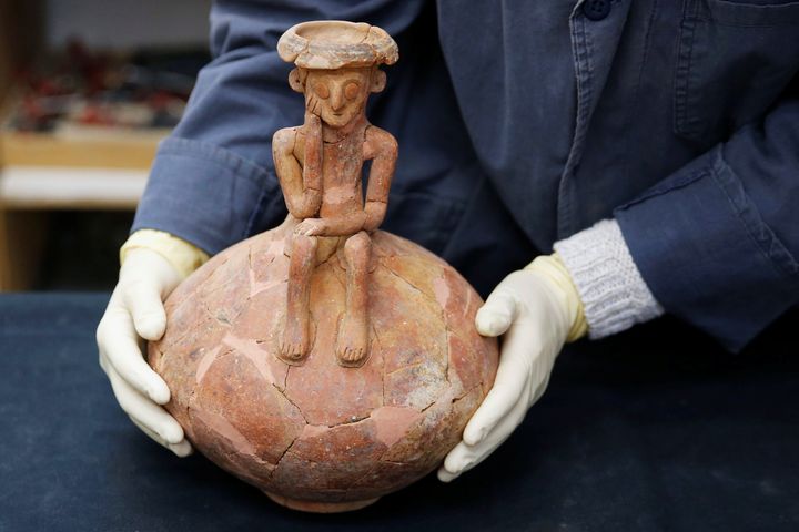 The 3,800 year-old pottery jug with a rare statuette, discovered during excavation in central Israel, at the Israel Antiquities Authority offices.