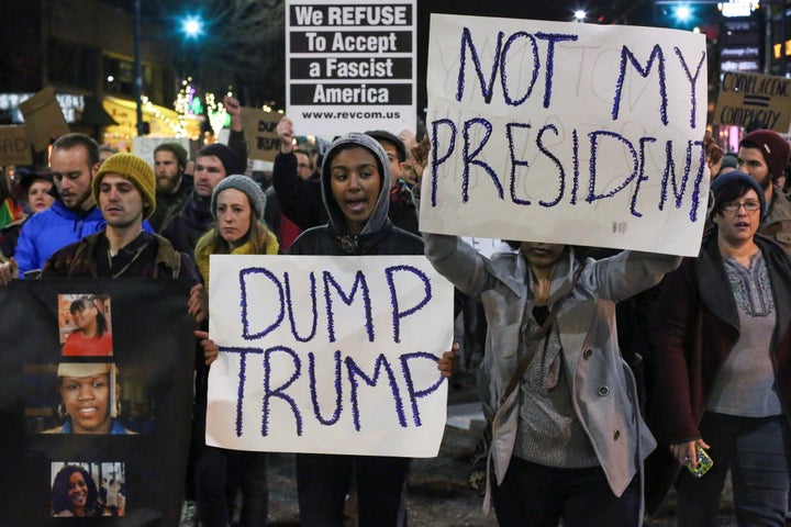 Demonstrators shout during a rally against U.S. President-elect Donald Trump in Seattle, Washington, U.S. November 20, 2016.